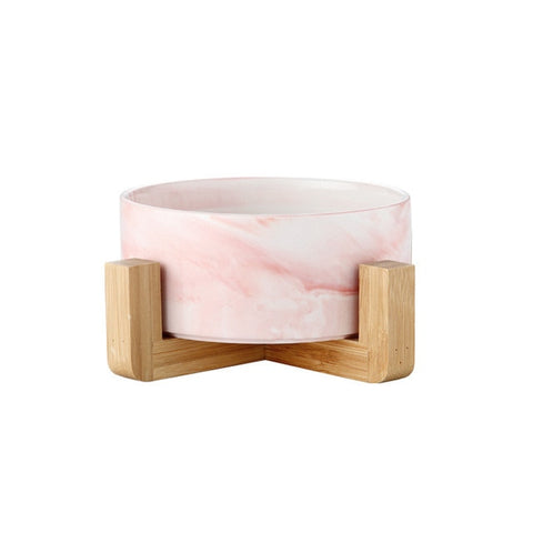 This Ceramic Pet Bowl is perfect for minimalist pet parents, with a wood base to add some texture to the clean marble design. In an adorable graphic on the side so everyone knows which bowl is just for your cat. Inside, there are even more furry personalities thanks to the round shape at the bottom of the bowl.  