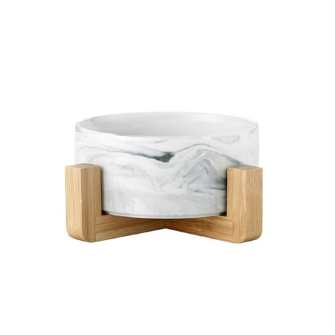 This Ceramic Pet Bowl is perfect for minimalist pet parents, with a wood base to add some texture to the clean marble design. In an adorable graphic on the side so everyone knows which bowl is just for your cat. Inside, there are even more furry personalities thanks to the round shape at the bottom of the bowl.  