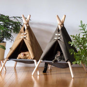 Give your kitty a mini vacation with the Wooden Tent Cat Bed. Equipped with fun tiebacks, poles, and decorative roping, this bed will have your cat sleeping resort-style in your home. It is composed of durable upholstery and soft plush, purr-fect for long naps or cozy observation.